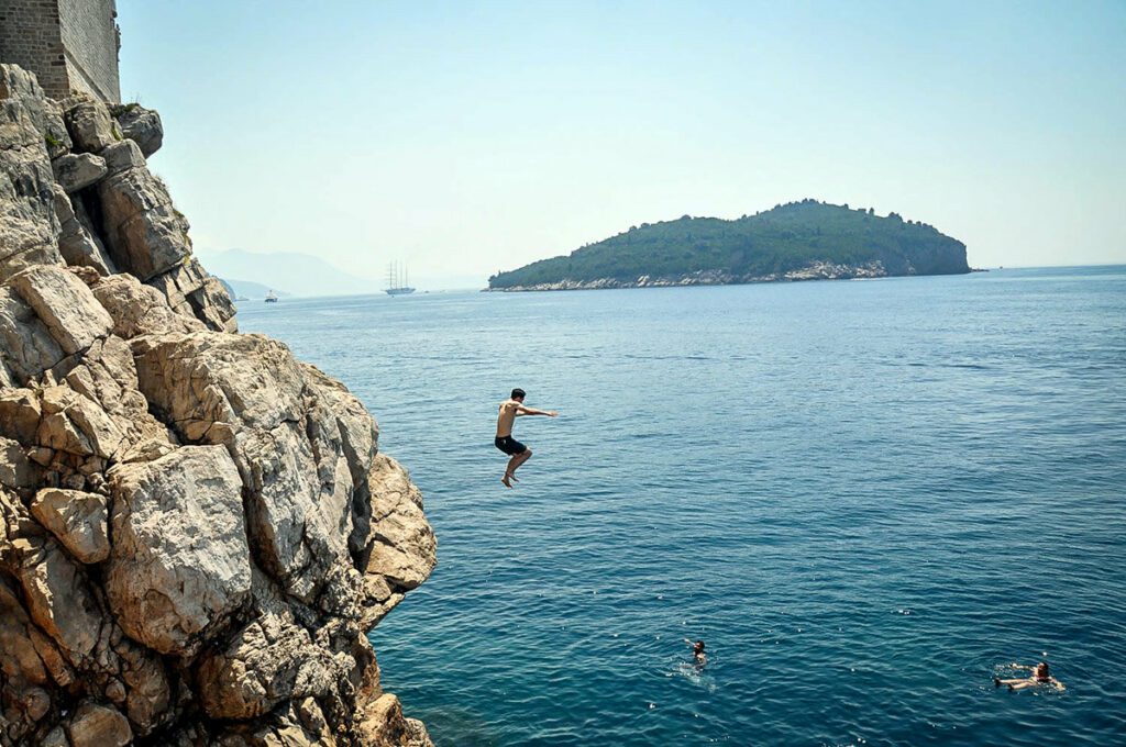 Cliff jumping at Buza Bar Dubrovnik Croatia.