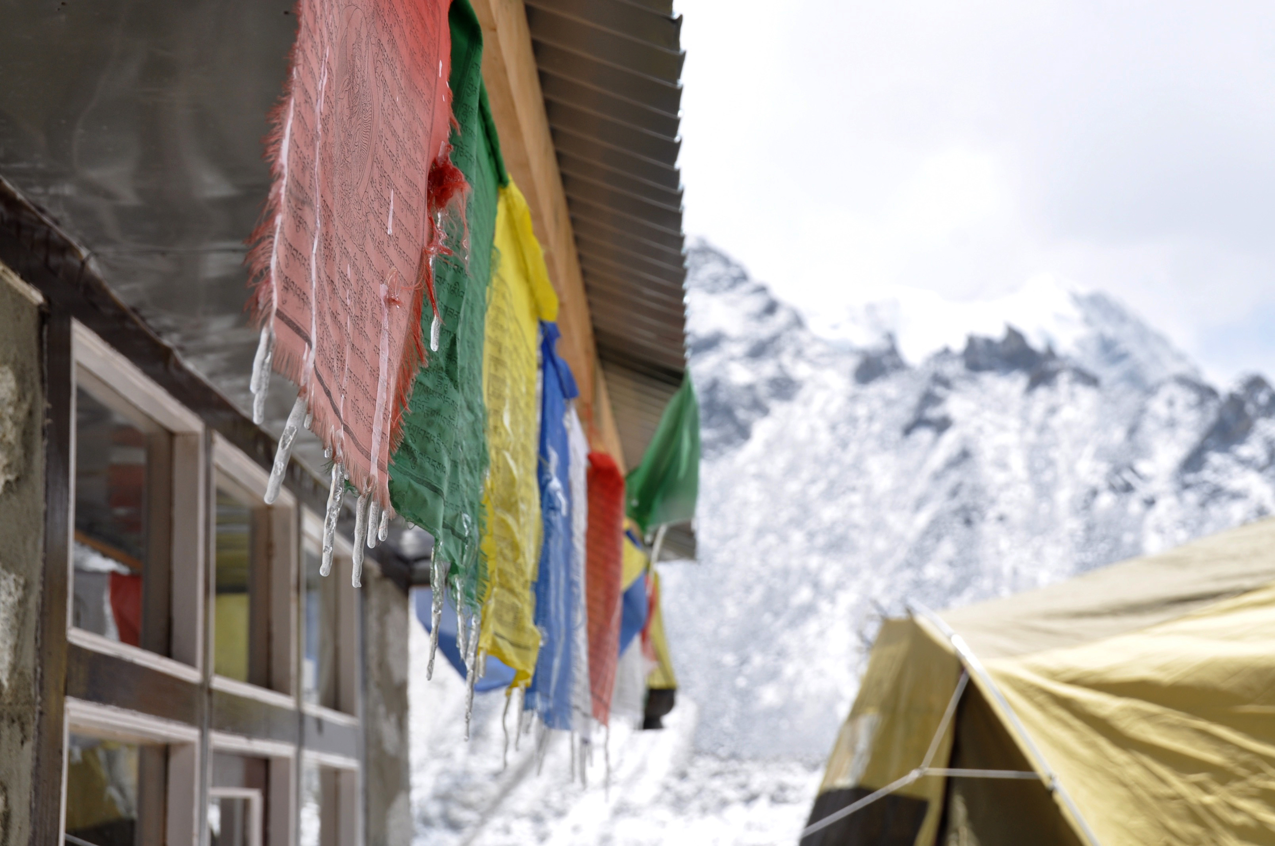 Everest Base Camp trek prayer flags icicles