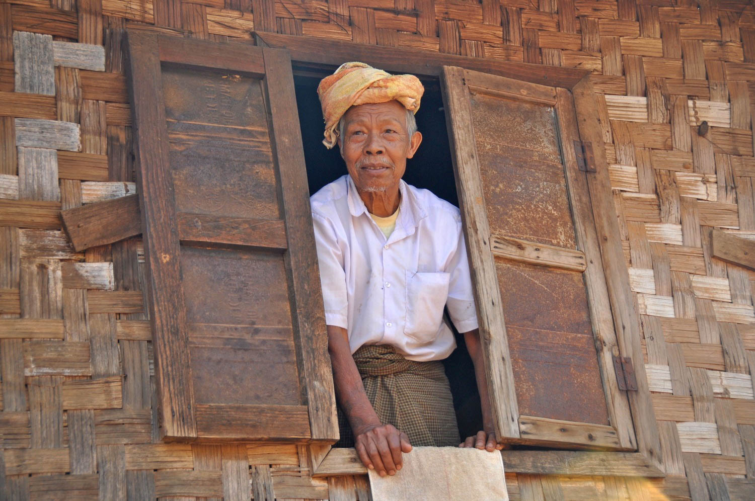 Myanmar Old Man in window
