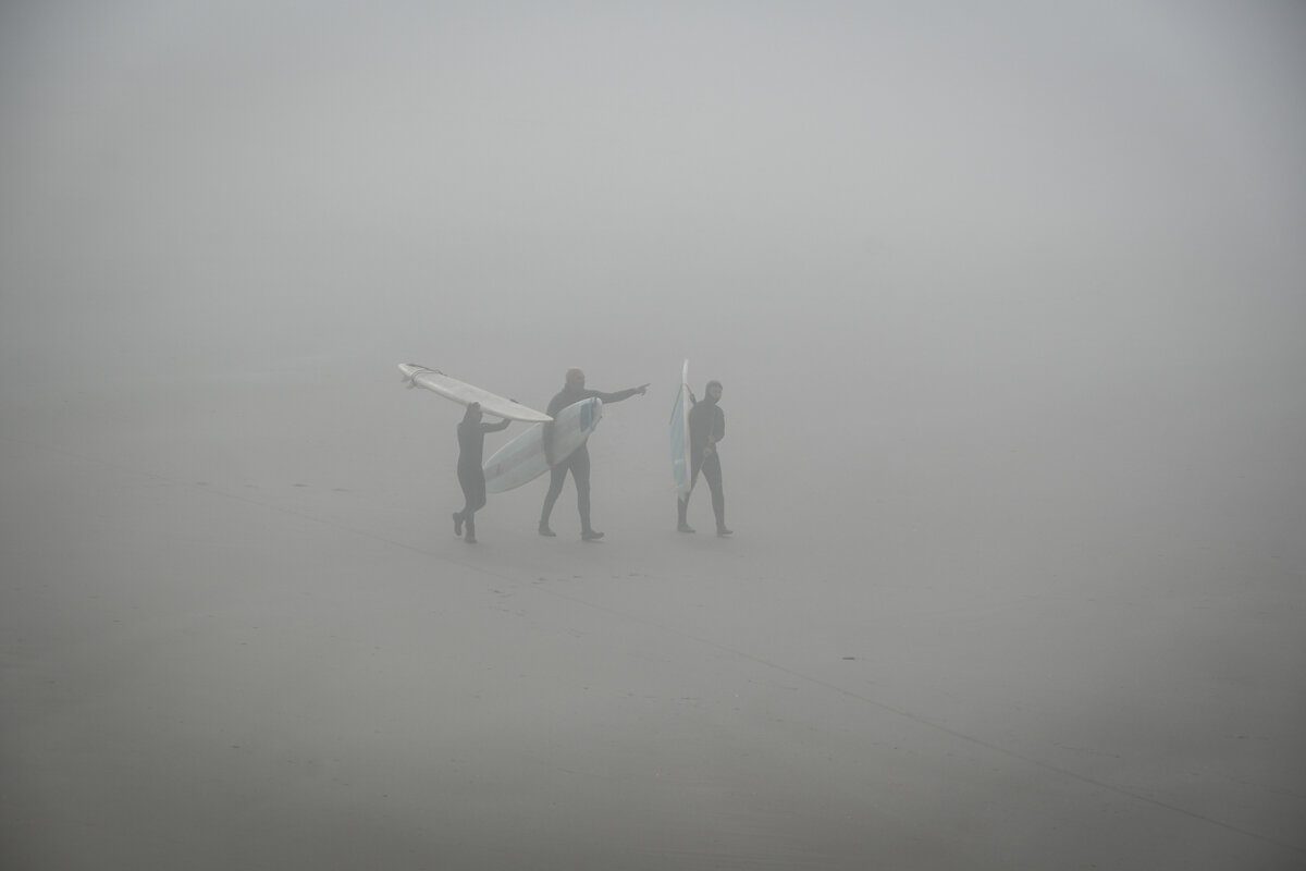 See how thick the marine layer can get?! The ocean is just in front of these surfers, but you can’t see the water!