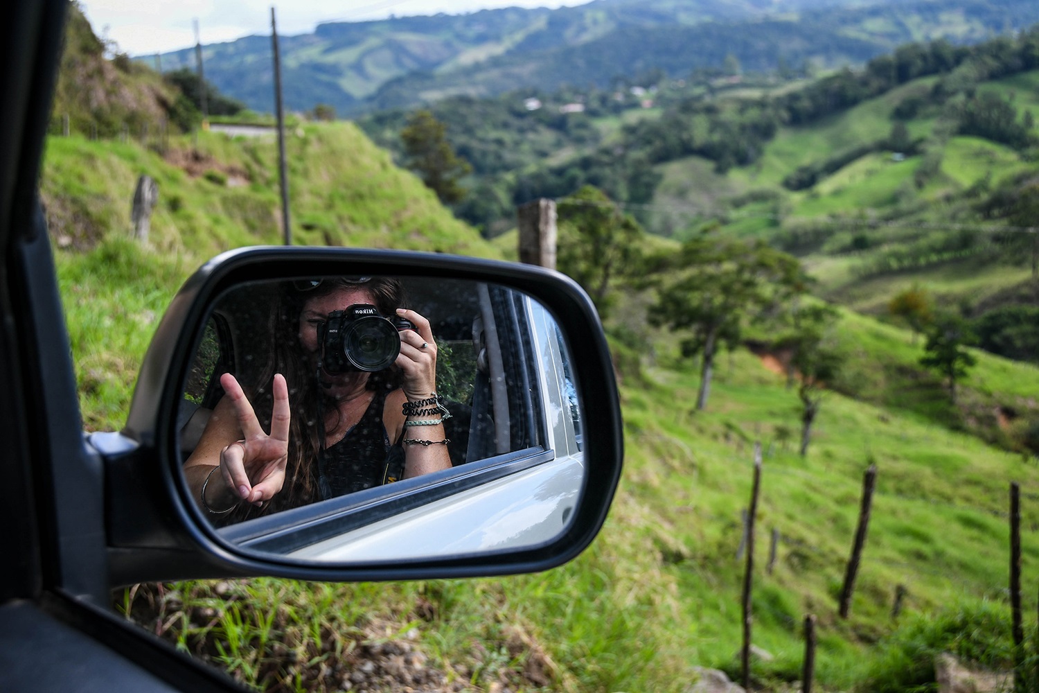 Renting a Car in Costa Rica Side mirror and countryside