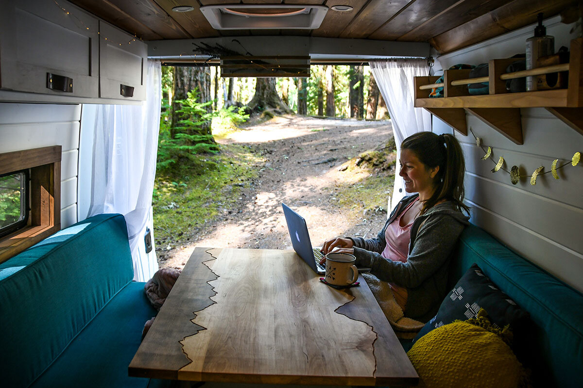 This is where we eat and work from inside our van. At night, it easily transforms into a bed, making really good use of our limited space.