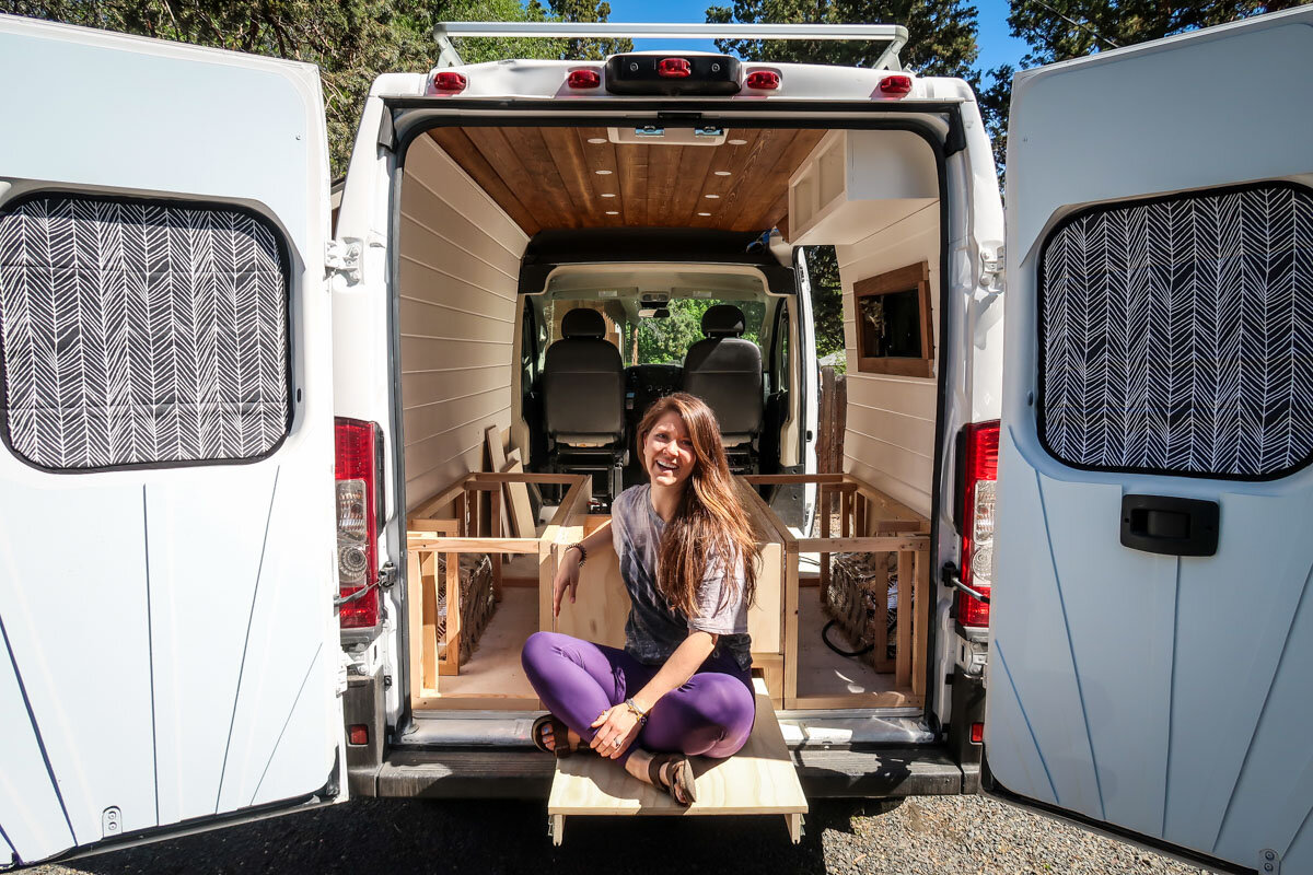 I really wanted to have an area to relax out the back of the van, so we built this sliding “deck” into our design.