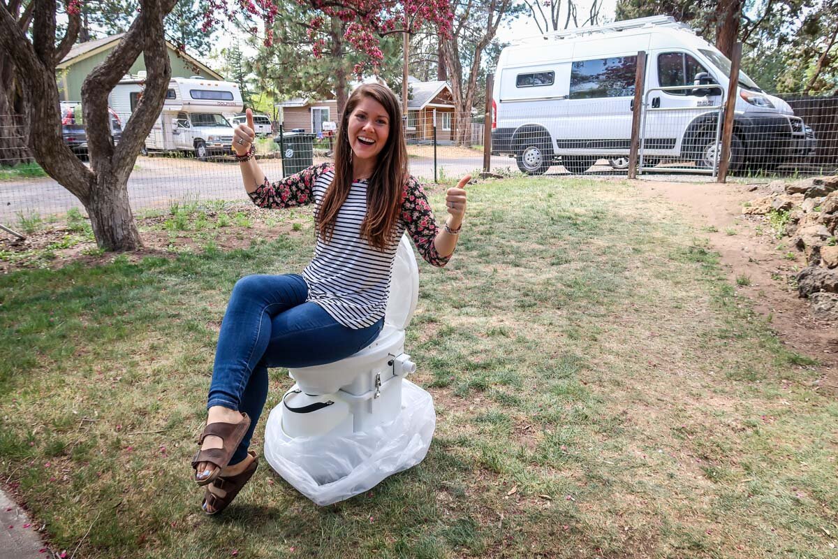 Me “testing out” the toilet right after it arrived in the mail! Not sure what our neighbors thought…