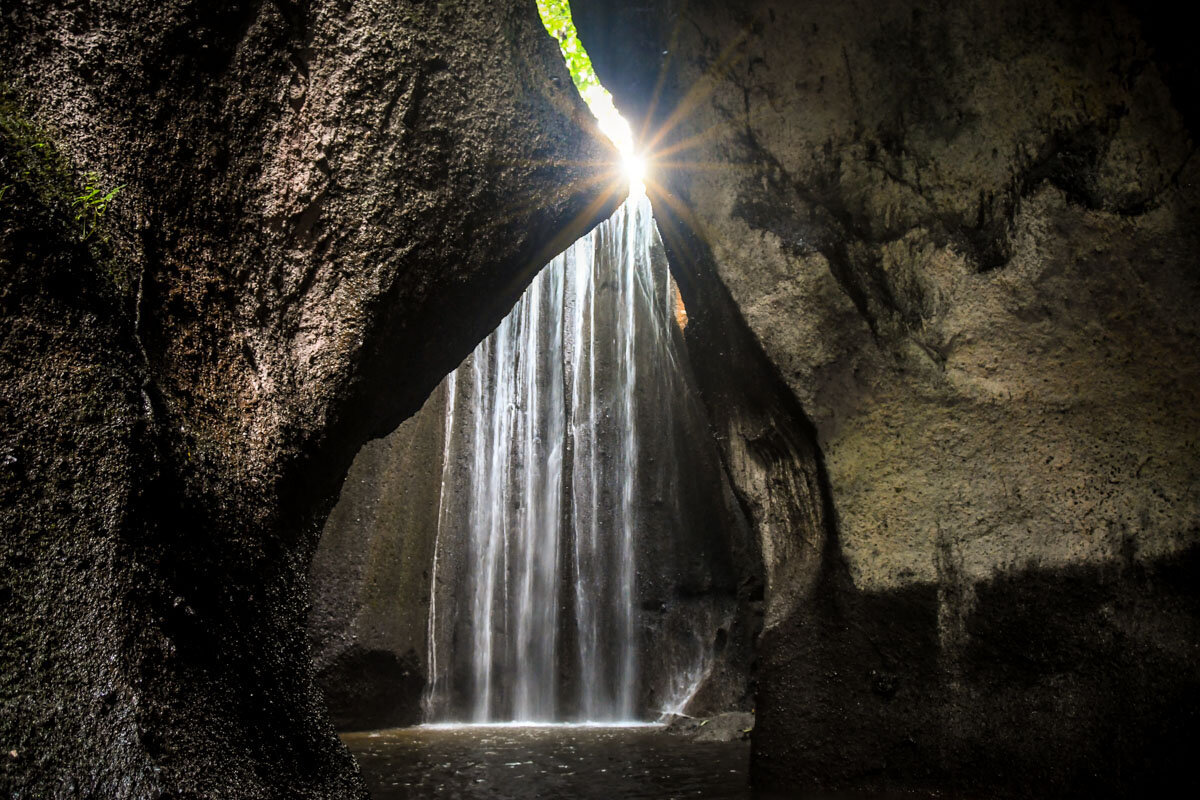 Stop by Tukad Cepung Waterfall if you are driving by motorbike (but get there early!)