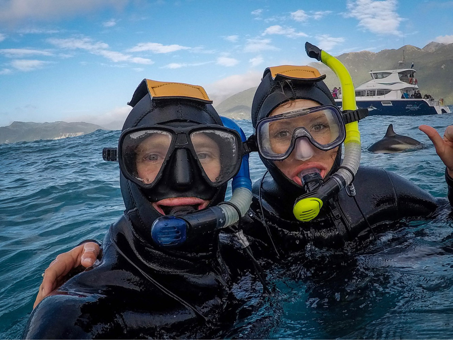 This is one of our favorite selfies we’ve ever taken! Can you spot the dolphin that decided to make an appearance in our photo?! Such a lucky shot!