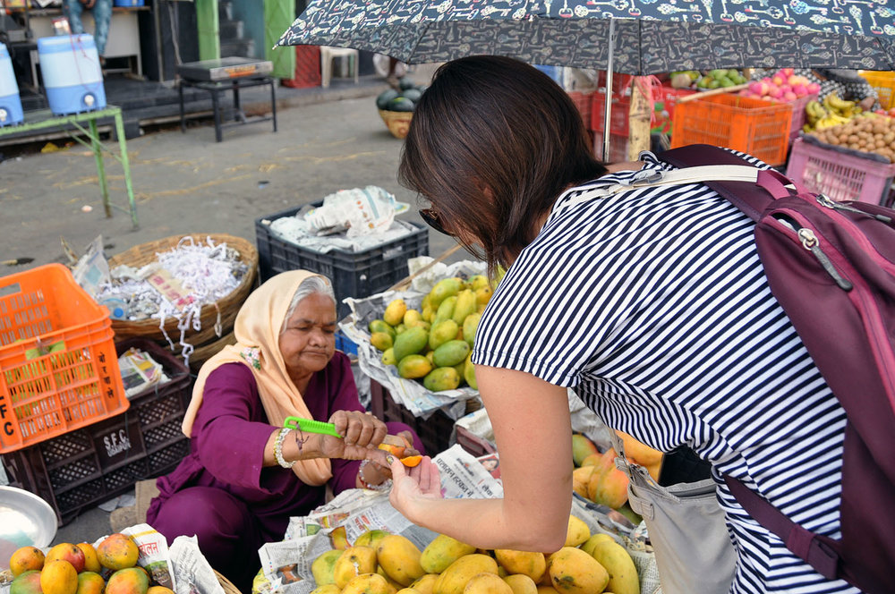 Shopping at a fruit market Cheap Travel Hacks