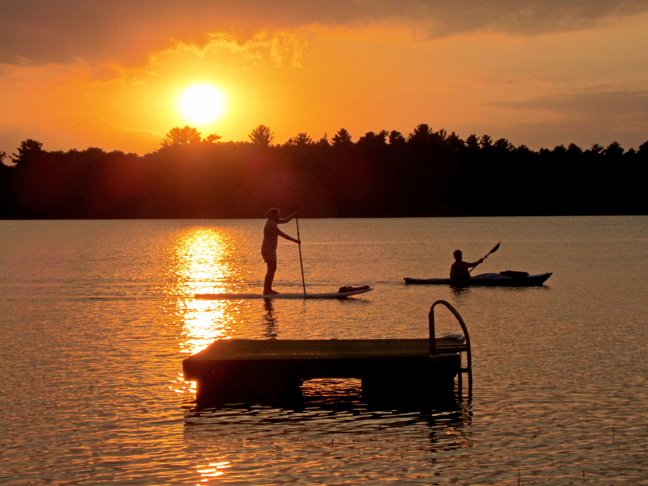 Paddleboarding at sunset