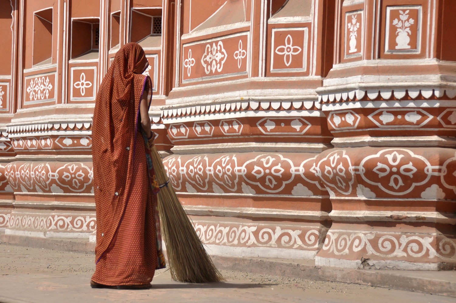 Woman cleaning the streets in India