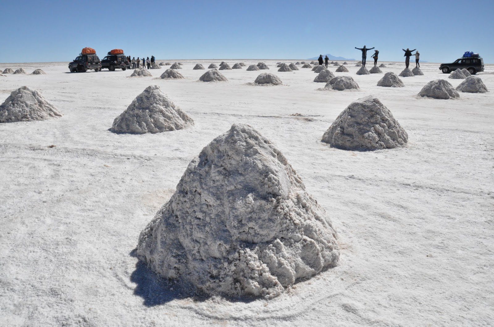 These mounds of salt are a result of the mining process.