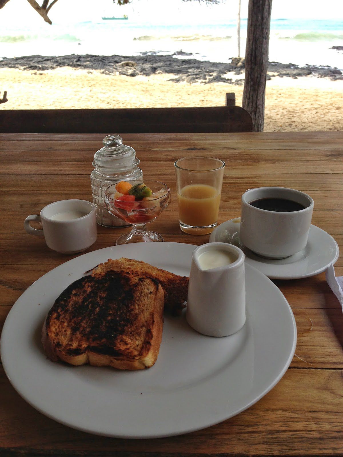 On the menu this morning: French toast, fruit cup, yogurt and honey, fresh papaya juice, and coffee. Delish.