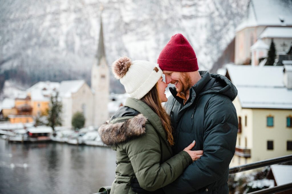 Couple photo in front of the iconic Hallstatt, Austria viewpoint during winter
