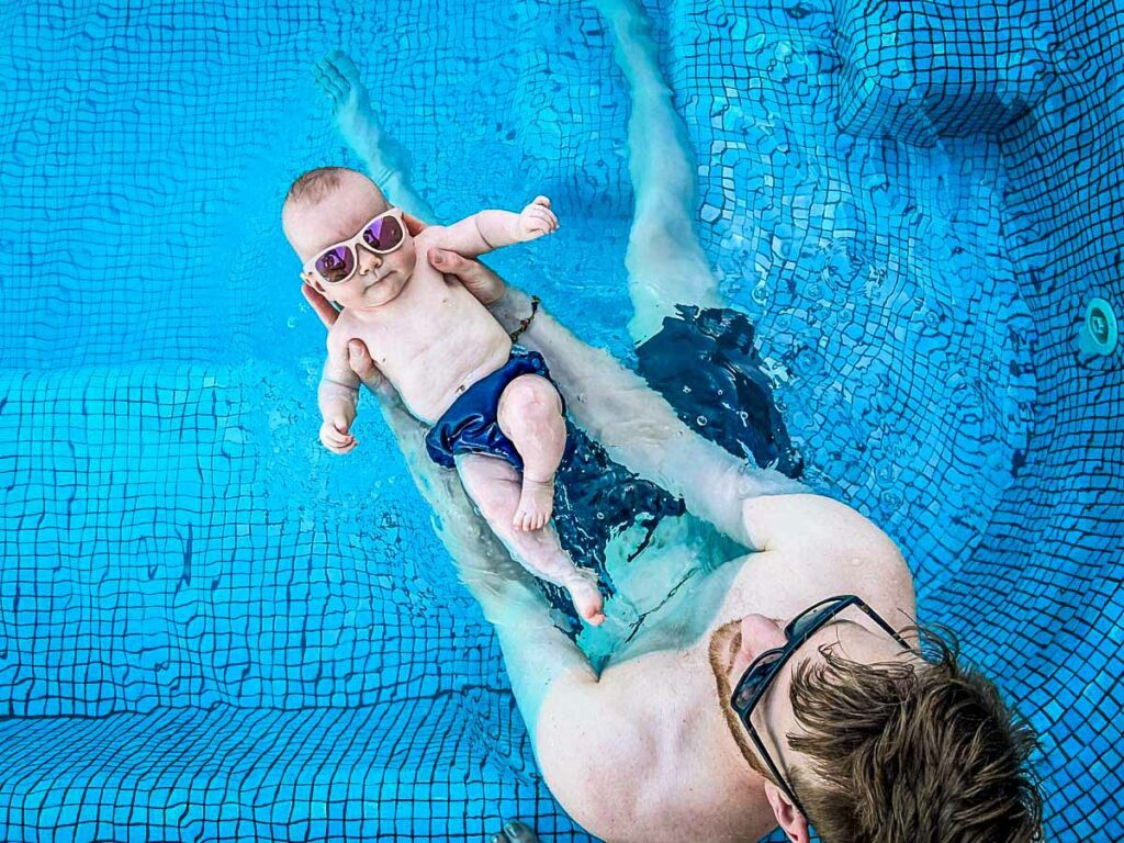 Baby swimming pool and sunglasses travel with a baby tips