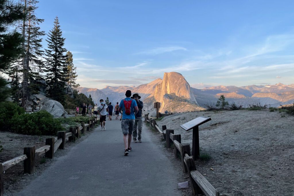 People walking to Glacier Point at sunset