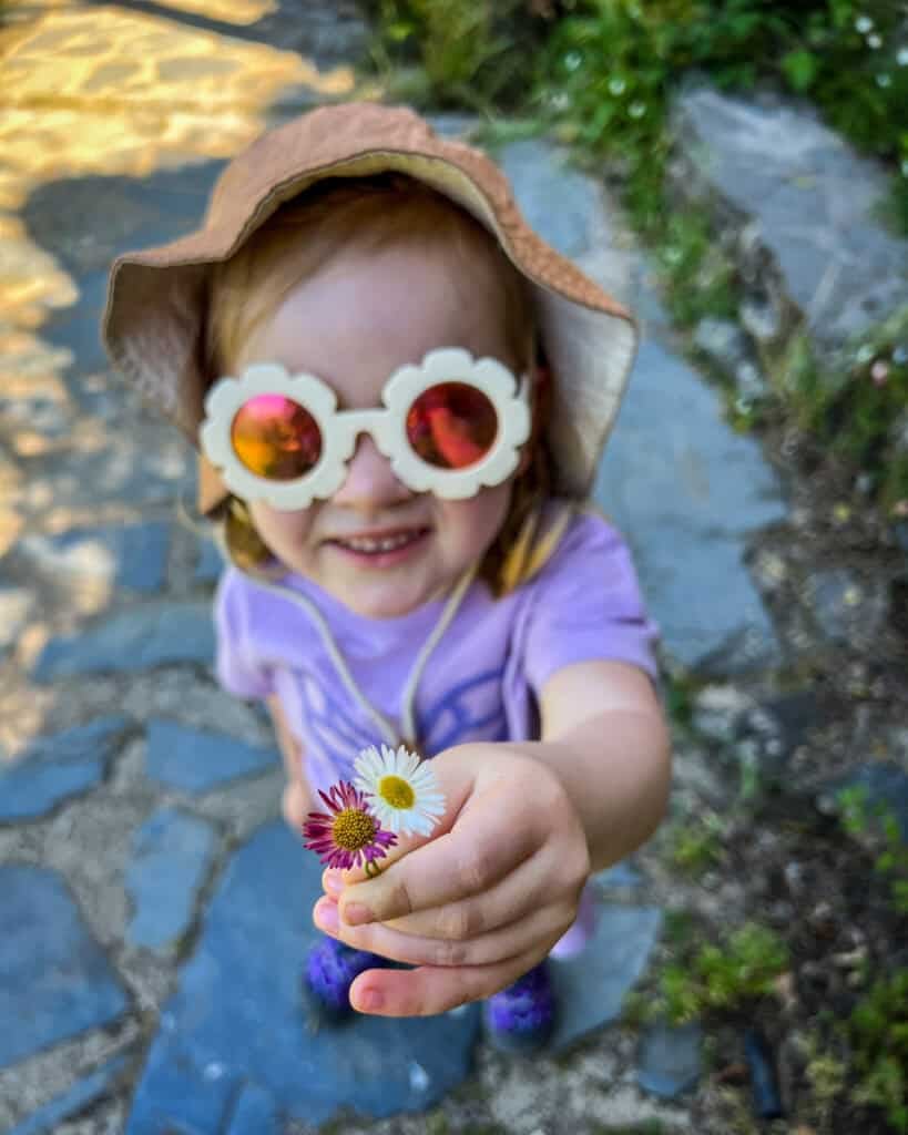 Juniper in Portugal with sunglasses and hat