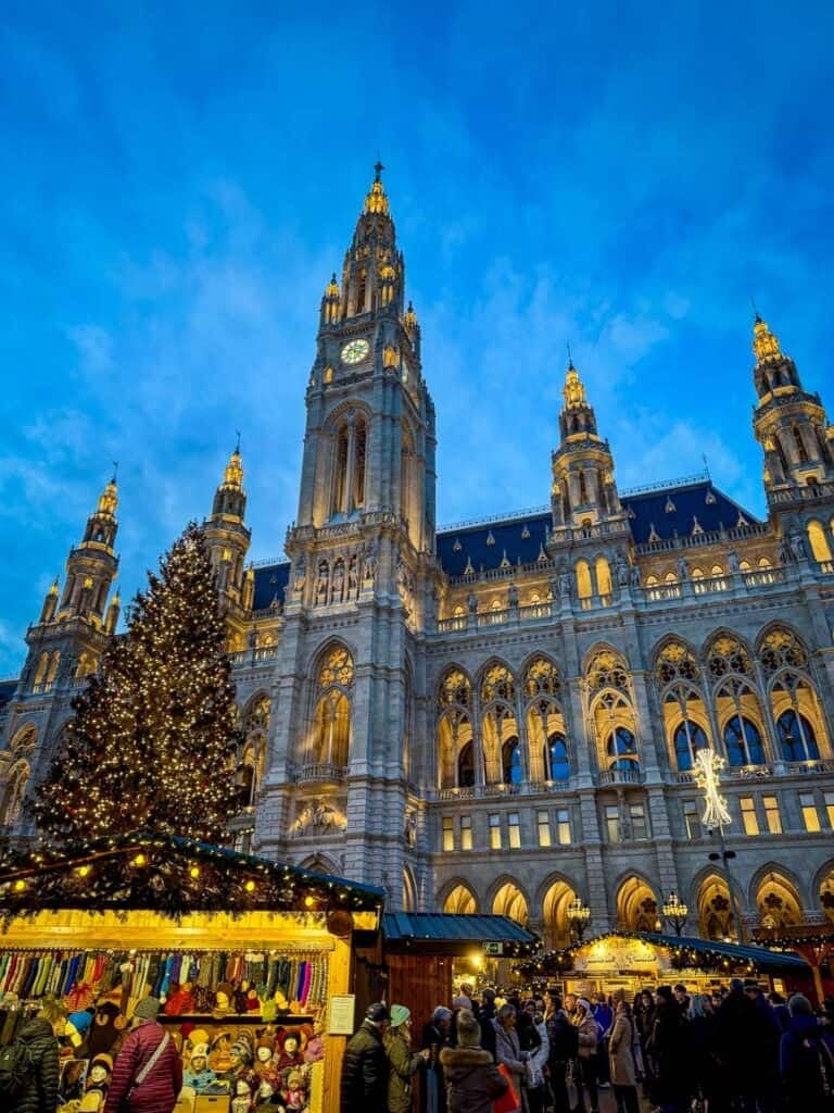 The Wiener Christkindlmarkt Christmas Market in front of the City Hall building in Vienna, Austria
