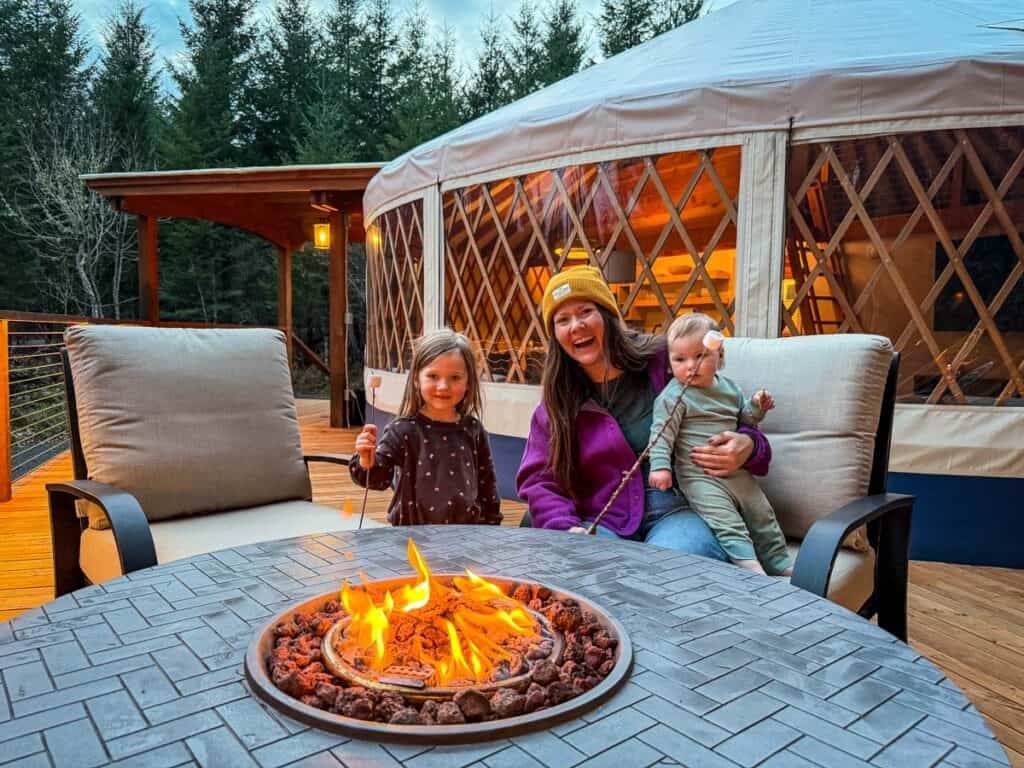 Family around the fire put at the Columbia Gorge Getaways yurt