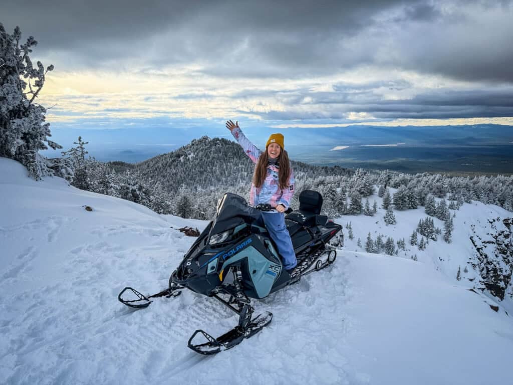 Katie on snowmobile at Paulina Peak near Bend, Oregon