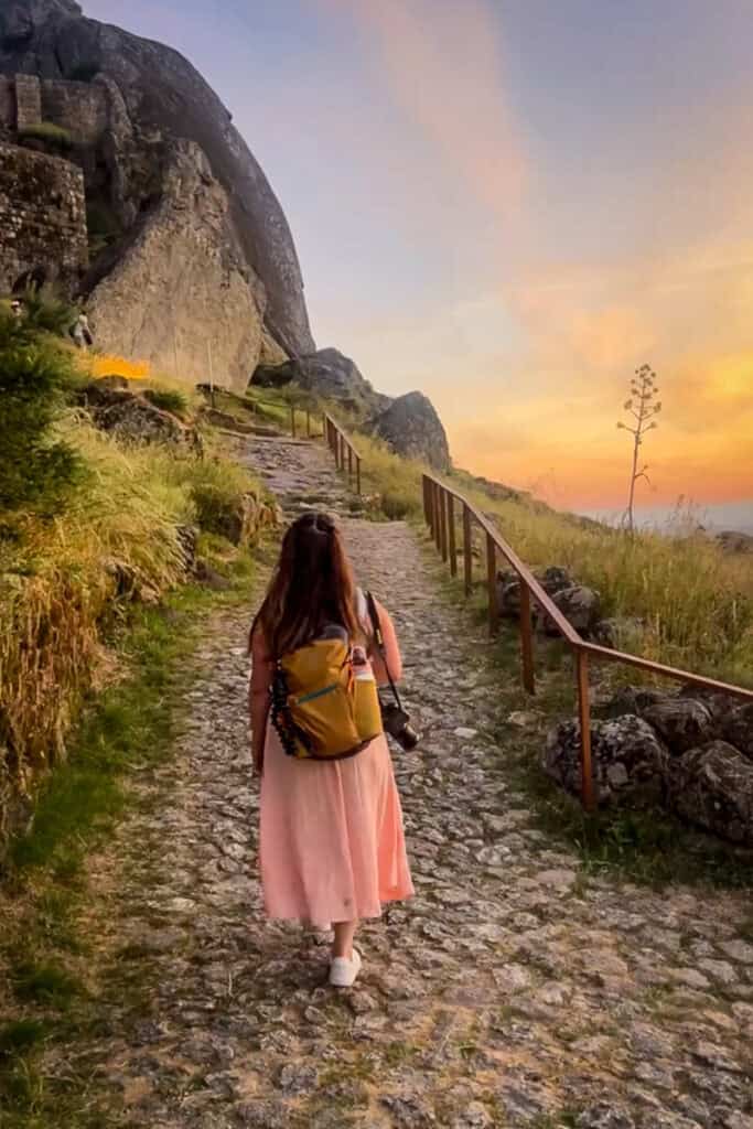 Katie walking a path at Monsanto Castle in Portugal