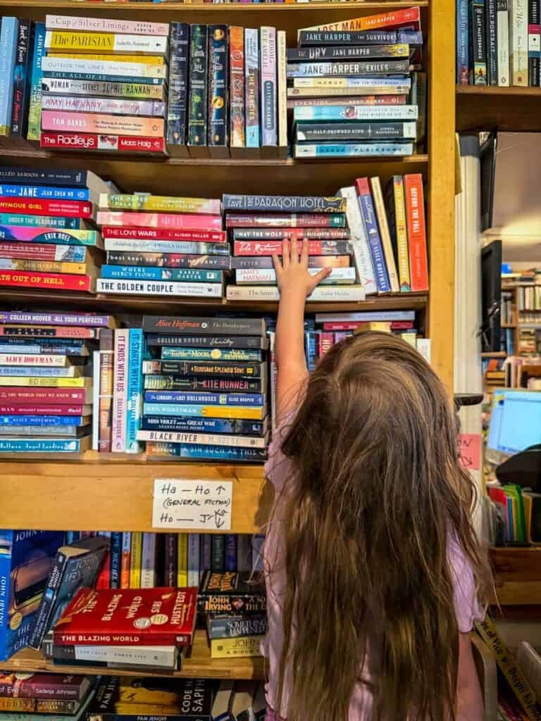 San Juan Island Serendipity Used Books child reaching for books
